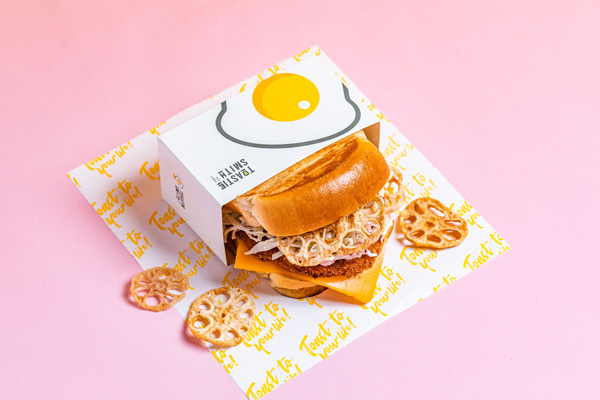 Toastie Smith Lying Down Pink Background